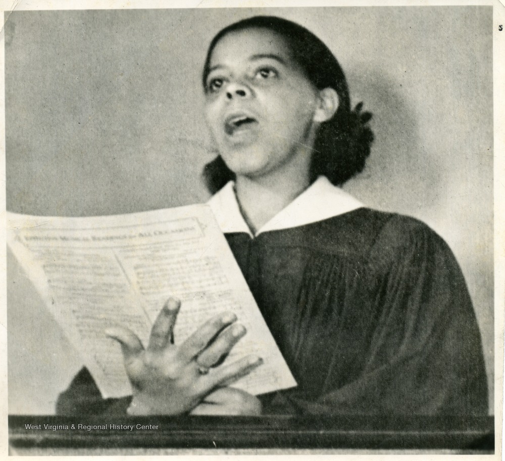 African-American student, Marion Virginia Johnson Reeler, holding sheet music and singing.